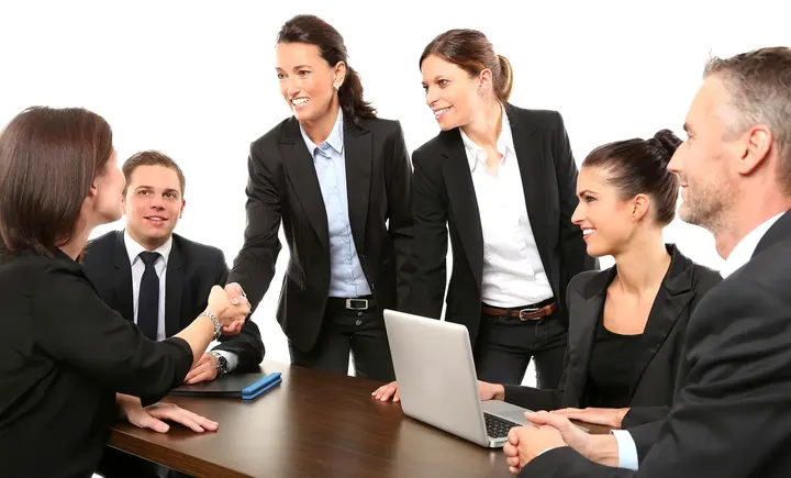 A team closing a deal with a local business